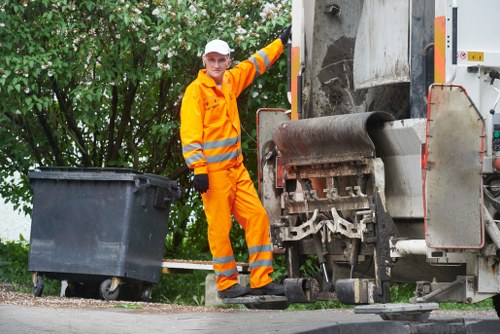 Clearing debris on a Hackbridge construction site